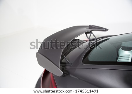 Close up of rear spoiler on sports car Royalty-Free Stock Photo #1745511491