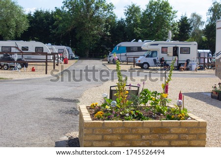 View of a small but busy caravan park in the summer near Cheltenham Royalty-Free Stock Photo #1745526494