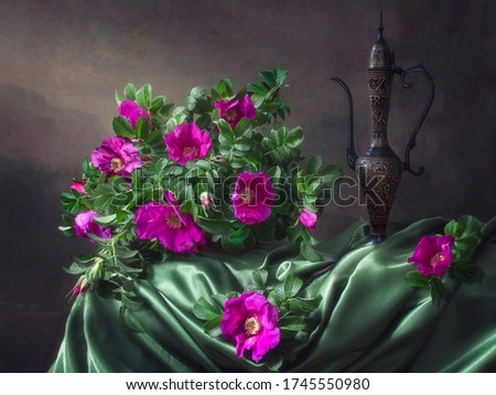 Still life with magenta dog roses