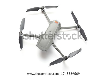Modern drone quadcopter with a camera isolated on white background. Top view.