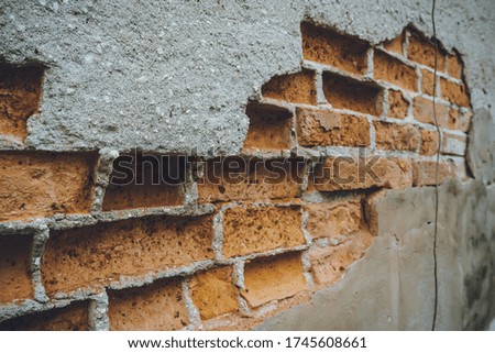 Old brick wall texture empty Red grunge stone wall background The building is shabby with a damaged mortar.