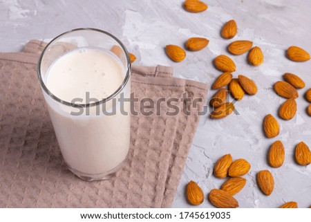 Organic almond milk above cotton towel, healthy