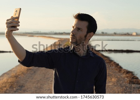 man making a selfie in the middle of nature