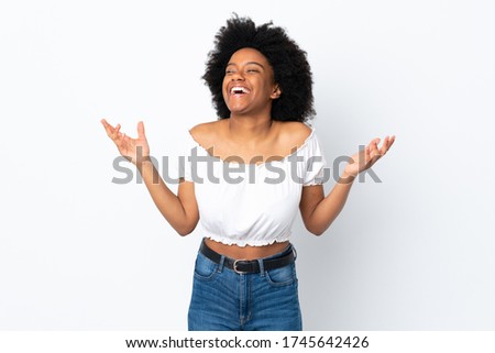 Young African American woman isolated on white background smiling a lot