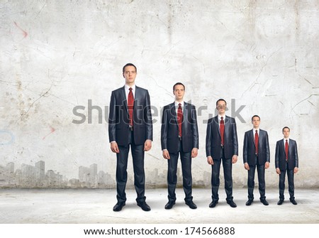 Successful confident businessmen standing in line. Progress in career