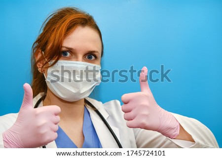 Doctor hands in a pink medical glove, gives a thumbs - up gesture of approval. A nurse in a white uniform makes a gesture that everything is fine