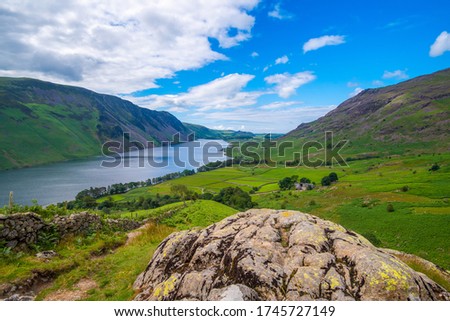 View down the length of Wast Water looking  towards Ravenglass from the path to the summit of Yewbarrow mountain, Lake District National Park, Cumbria, England.   Royalty-Free Stock Photo #1745727149