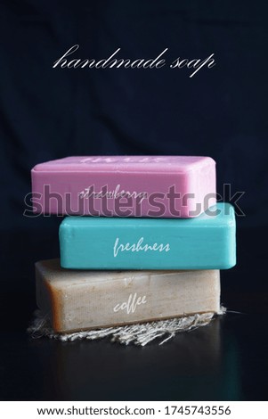 Cosmetic soap with various flavors on a black background.