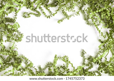 Green Christmas tinsel garland, forming a rectangular frame with white center copy space, isolated on white background