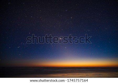 Starry sky, planet Venus, sunset landscape of the Pacific Ocean