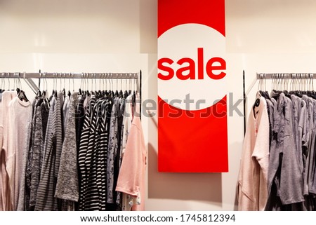 Sale inscription in shopping center. Discounts and shopping concept.
