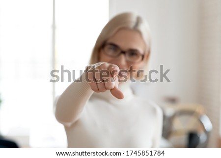 Focus on smiling female hr manager pointing finger at camera. Happy 30s blonde businesswoman employer making choice, asking join international company, looking for you, human resources concept.