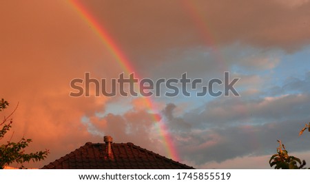 Blue sky with clouds and double Rainbow                 