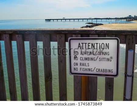 Pier Sign on the Beach