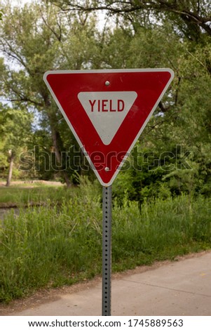 yield sign on the path