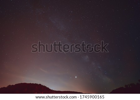 Spring Milky Way and satellites in the night sky.