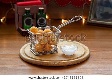 Potato chips, squid, shrimp, cheese sticks, with sauce, beer snack on the table