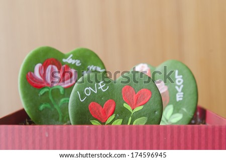 Heart-shaped leaves and messages about love, Valentine's Day.