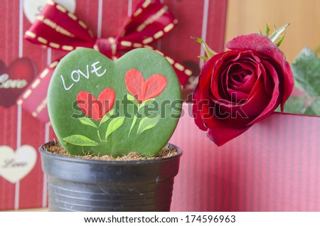 Heart-shaped leaves and messages about love, Valentine's Day.