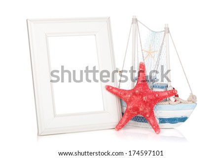 Photo frame, starfish and decor boat. Isolated on background