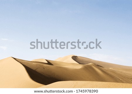 This is a picture of the Chinese Silk Road.
The blue sky and desert ridges are beautiful.