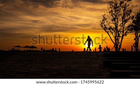 Picture of relaxation of people in the pool in resort in sunset time on summer vacation. Family holiday travel concept. Crowd of people or friend playing together in the swimming pool.
