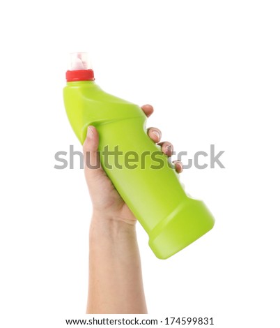 Hand holding green bottle. Isolated on a white background.