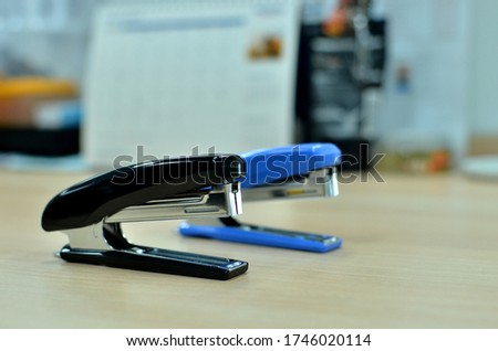 Office Stapler on desk background
