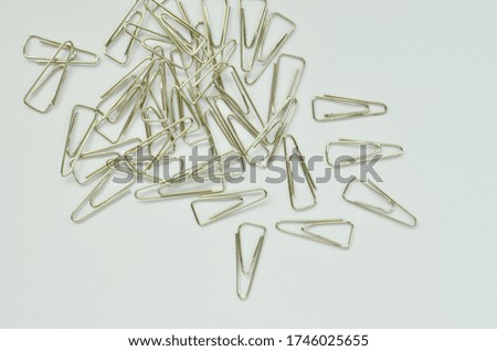 Office, paper clip on white background