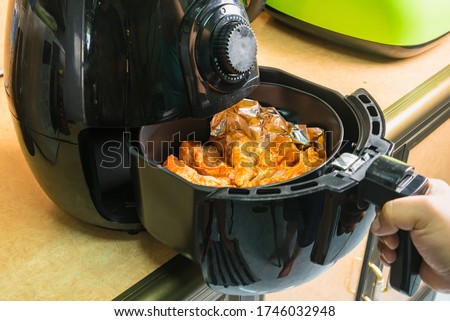 Chef's Grill BBQ Chicken Legs in oven air fryer.healthy cooking without oil Royalty-Free Stock Photo #1746032948