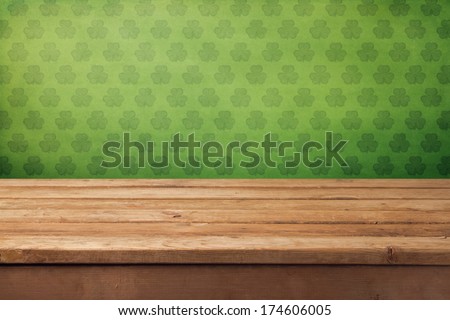 St.Patrick's day background with empty wooden table and wallpaper