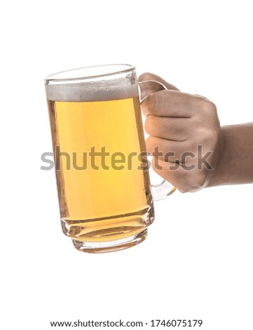 hand hold glass mug of beer isolated on white