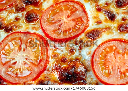 pizza Margarita close up with cheese and tomatoes
