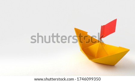 Red flag Orange Origami Paper Boat. Sailing. Isolated on White Background. 
