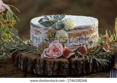 Wedding cake in flowers and figs