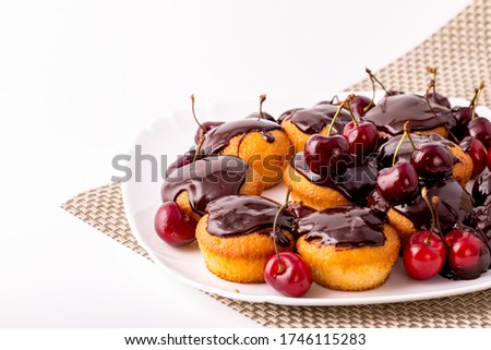 Homemade cupcakes with cherries and chocolate. Classic dessert. Cooking dessert at home.