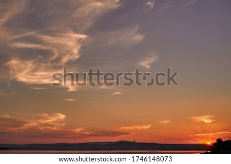 A sunset over a body of water