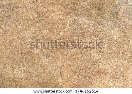 Grainy decorative rich stone / rock background with subtle texture / facture natural pattern