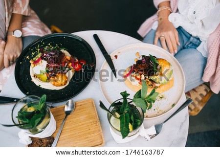 picture of healthy delicious dish in restaurant menu with organic ingredients and spices, top view of modern cuisine with colorful veggie meal vegetables and tomatoes in healthy nutrition menu