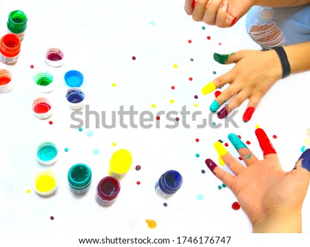  painted fingertips the hands of young people. Art, hobbies 