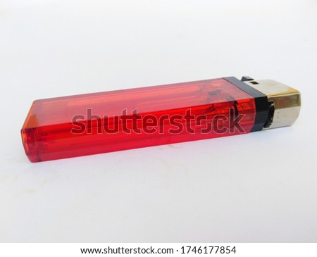 red gas lighter in white background