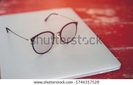 Glasses and laptops Eye protection devices for nearsighted people or people who work on computer screens for a long time. Images for your business.