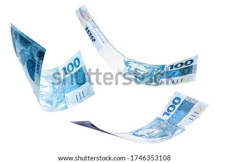 banknotes of one hundred reais from brazil falling on isolated white background. Concept of falling money, devaluation of the real or financial crisis.