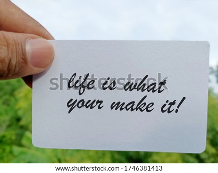 life is what your make it. inspirational and motivational quotes on hand with sky background