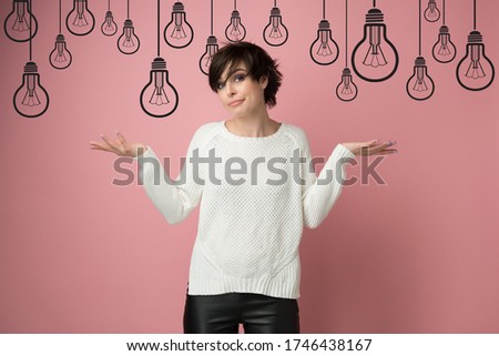 Beautiful young woman with nothing to do gesture over cartoon drawn lamps. Girl using language of body to say apologies, regret, failure, no idea bulbs above head. Creative crisis, difficult problem