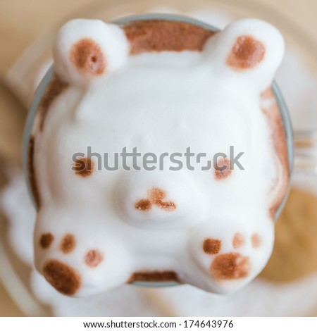 Cute latte art on a cup of coffee