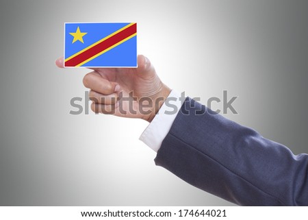 Businessman holding a business card with Democratic Republic of the Congo Flag 