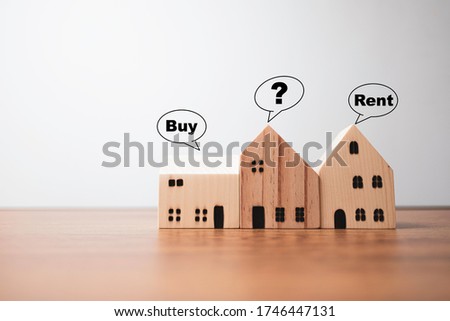 Three house with buy rent and question mark wording.It is s a choice for best selection.
