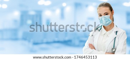Doctor wear face mask in hospital protect from coronavirus disease or COVID-19. Medical staff are high risk people to receive infection from coronavirus disease or COVID-19. Royalty-Free Stock Photo #1746453113