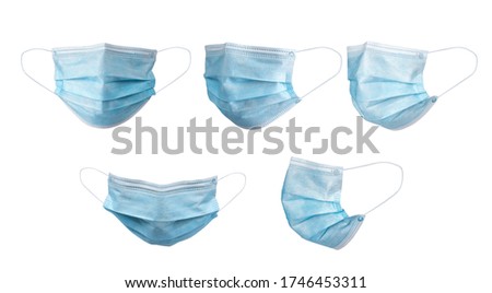 Medical face mask isolated on white background with clipping path around the face mask and the ear rope. Concept of COVID-19 or Coronavirus Disease 2019 prevention by wearing face mask. Royalty-Free Stock Photo #1746453311